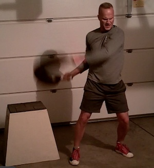 Superset workout with a plyometric box and a bulgarian training bag